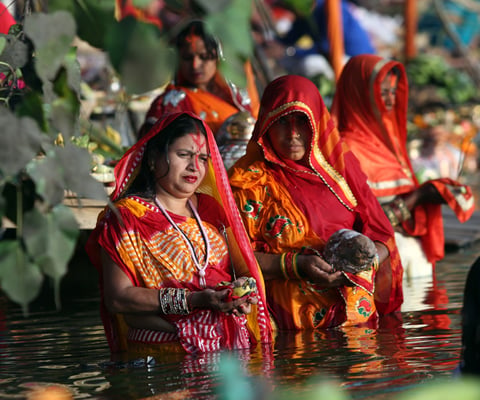Women take a holy dip in a pond in Janakpur during Chhath on Sunday.