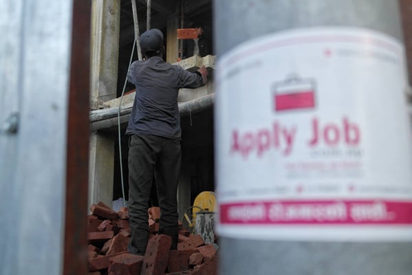 A worker stacks bricks at a construction site in Basantapur on Thursday.