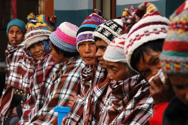 STAY WARM: A group of men fight low temperatures with wool blankets and huts at Missionary home in Kathmandu.