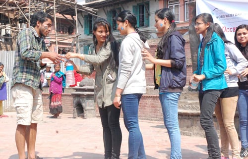 A group of girls queue up to wash their hands on Global Handwashing Day at Basantapur on Monday.
