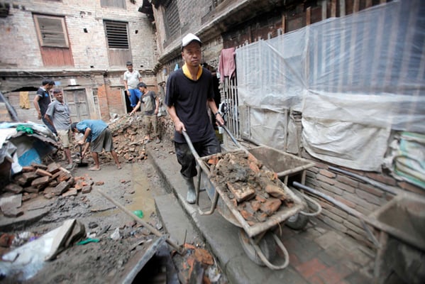 Japanese volunteer Takahiro Suzuki helps clear the debris in Bhaktapur on Wednesday. He is in Nepal to volunteer in earthquake-affected areas over the summer.