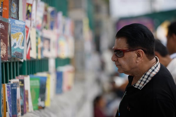 Tourism entrepreneur Basanta Raj Mishra looks at secondhand books on sale at New Road Gate on Sunday.