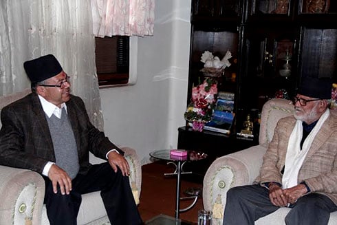 DEEP IN DISCUSSION: UML's Chairman Jhal Nath Khanal (left) meets Nepali Congress's Sushil Koirala, at his place in Maharajgunj on Thursday.