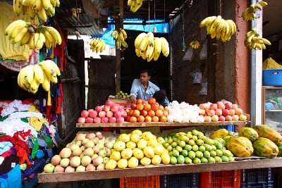 WELCOME EVERYBODY: A fruits stall owner waits idly for customers in Boudha on Sunday morning.