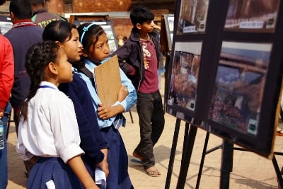 HOW INTERESTING: School girls look at exhibits put up as part of a safe drinking water campaign in Patan Durbar Square on Friday.