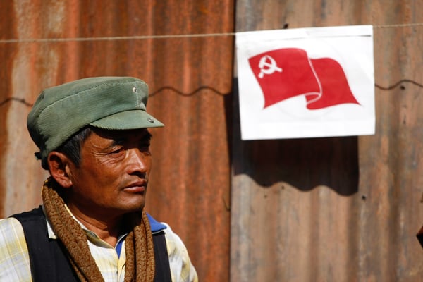 TALK THE TALK: A man listens to leaders of UCPN(M) during the 7th District Convention at Mangalbajar, Lalitpur on Tuesday.