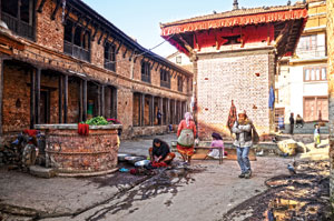 PUBLIC LIFE: Residents of Khokana in Lalitpur gather near a water well to wash their clothes.