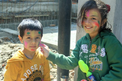 Children celebrate Fagu Purnima or Holi in Kathmandu on Thursday.