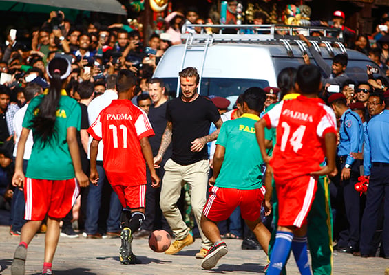 Football star David Beckham plays football with local children of Padma Higher Secondary School at Bhaktapur on Friday. He is here on a funding campaign for United Nations Children’s Fund (UNICEF).
