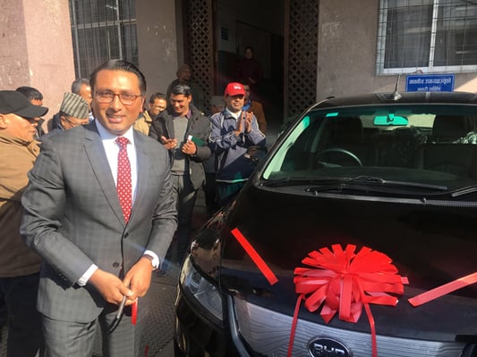 National Planning Commission Vice-chair Swarnim Wagle with the Commission's newly acquired electric vehicle Chinese made BYD e6 on Friday.