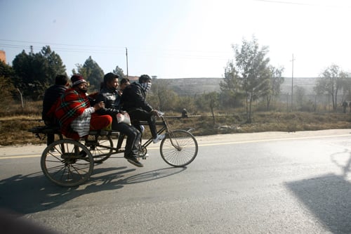 People travel to their destination by a pulling rickshaw during Kathmandu Valley Bandha called by the UCPN (Maoist)-led alliance on Tuesday.