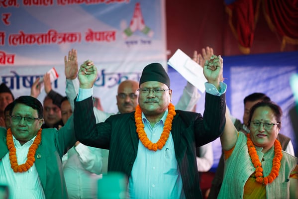 Bijay Kumar Gachhadar (centre) of Madhesi Janadhikar Forum (Loktantrik), Shiva Lal Thapa (right) of Rastriya Janamukti (Loktantrik) and Dalit Janajati Party's Yashoda Lama (left) announce unification of the three parties at an event in Tinkune on Wednesday.