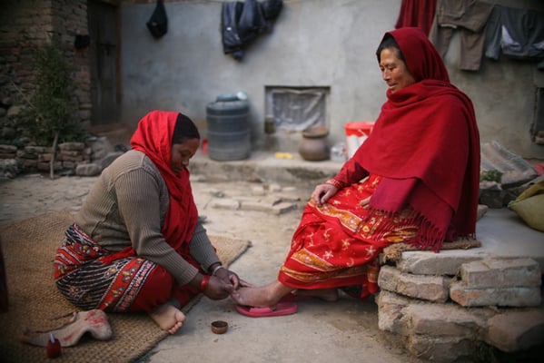 40-year-old Kanchi Napit, a traditional nail-cutter, clips finger nails of her client in Bungamati on Tuesday. Napit’s family have been professional nail cutters and barbers for as long as she remembers. Today, the skills along with the profession is on the verge of vanishing forever.