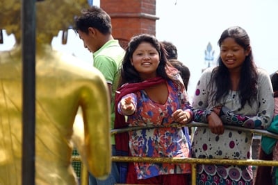 MAKE A WISH: A woman throws a wishing coin into the pot in the World Peace Pond in Swayambhunath on Thursday as World Heritage Day 2013 is commemorated.
