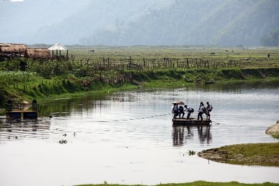 WHATEVER IT TAKES: School children cross the Phewa Taal to make their way to school in Pame, Pokhara on Sunday morning.