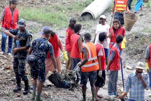 CLEAN IT UP: Police personnel and volunteers clear trash from Bagmati River as part of the Save Bagmati Campaign on Saturday.