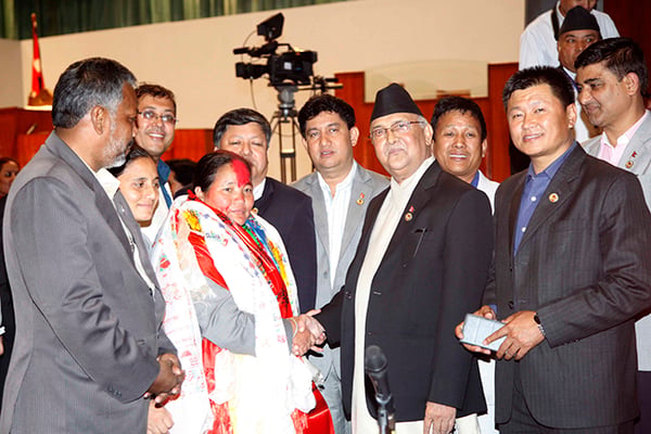 Prime Minister KP Sharma Oli congratulates the new Speaker of House UCPN(M) lawmaker Onsari Gharti Magar at New Baneswor on Friday.