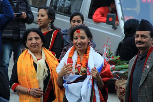 Susmita Maskey, the first Nepali woman to conquer the tallest mountains of each of the seven continents, arrive at the Tribhuwan International Airport on Friday