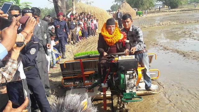 Prime Minister Pushpa Kamal Dahal drives a transplanter at the launch of Paddy Super Zone program in Jhapa on Tuesday. In this easternmost Tarai district which registered the highest paddy output in 2016, the new program aims to increase paddy production through mechanised farming.