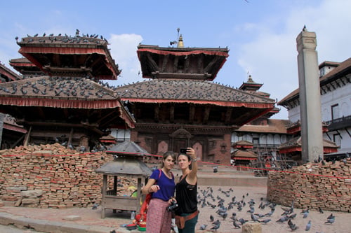 Two Spanish girls taking a selfie at Basantapur Durbar Square on Monday. More tourists are now flocking to Kathmandu's heritage sites.