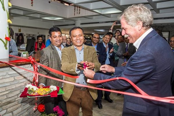 Nepal Electricity Authority's Managing Director Kulman Ghising (left) and ICIMOD's Director General David Molden (right) cut a red ribbon to inaugurate ICIMOD’s solar energy system, which sends excess solar energy to the national grid and help reduce load shedding in Nepal.