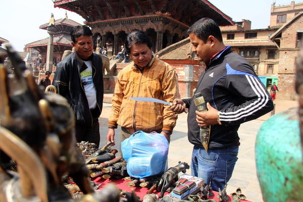 BLADES OUT: Locals shopping for khukuris at Patan on Monday.