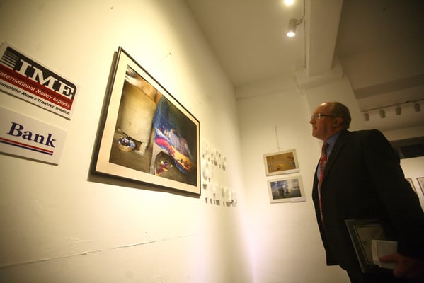 British Ambassador Andrew James Sparkes looks at the Photo of the Year winning photograph during the 4th Nepal Photo Contest at Nepal Art Council on Wednesday.
