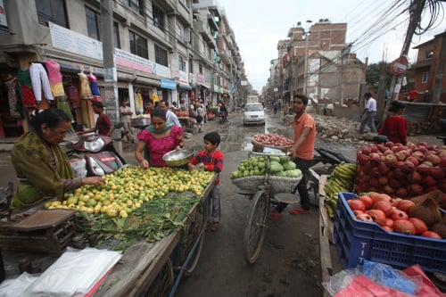 Street vendors sells fruits and vegetables in Bhimsen Gola on Tuesday.