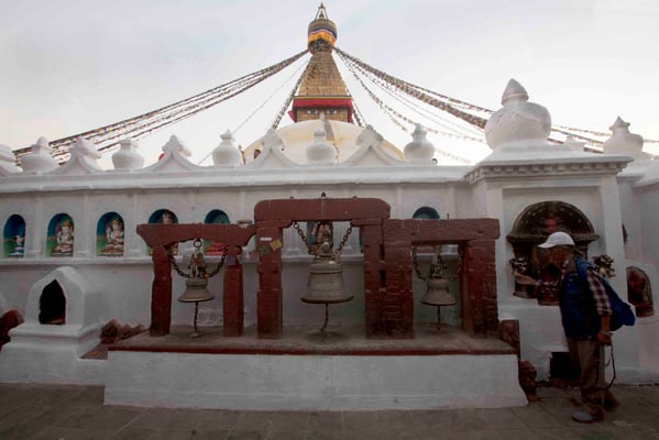 A devotee walks around the Boudhanath Stupa on Tuesday.