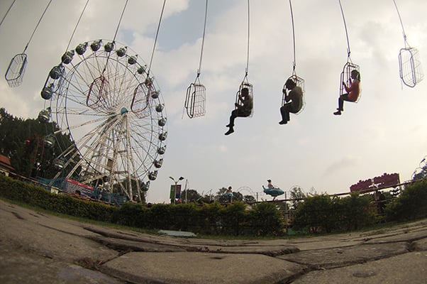 Children on the chair swing ride at Kathmandu Fun Park, Bhrikutimandap on Sunday.