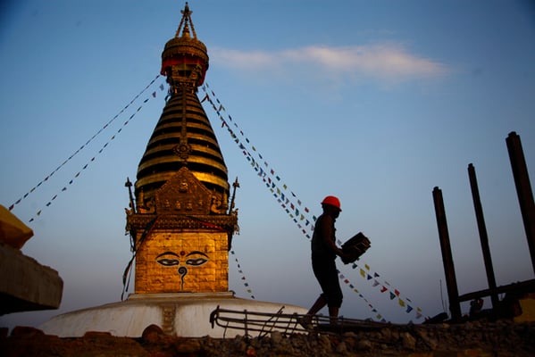 A worker at the Drukpa Kagyu monastery in Swayambhunath Stupa, one of the UNESCO World Heritage sites damaged in the April 2015 earthquake, in Kathmandu on Monday.