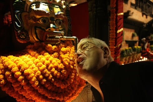 CHEERS: Foreigners enjoy local rice beer from the replica of Swet Bhairab at Dwarika's Hotel on Wednesday.