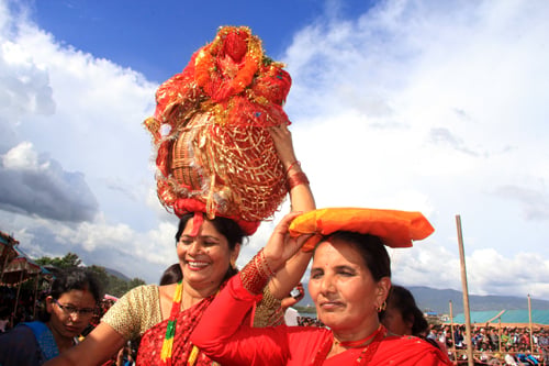 A woman carries a representation of Goddess Gauri on the occasion of Gaura Parva in Tundikhel on Tuesday.