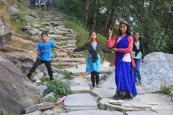 Children perform deusi-bhailo songs for Tihar on the way to Ghandruk.