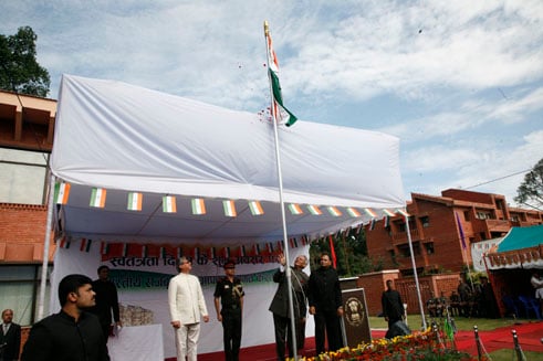 HAPPY 66th: Indian Ambassador Jayant Prasad (centre) hoists up India's flag in a ceremony to mark the country's Independence Day.