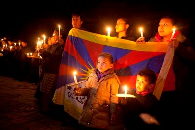 LIGHT OF HOPE: Tibetans in exile light candles to celebrate the third day of Tibetan New Year 2013 in Jawalakhel on Wednesday night.