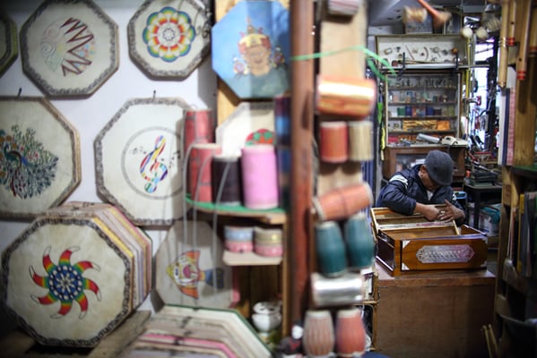 Hari Kul,57 repairs a harmonium in his music shop at Saugal on Monday.
