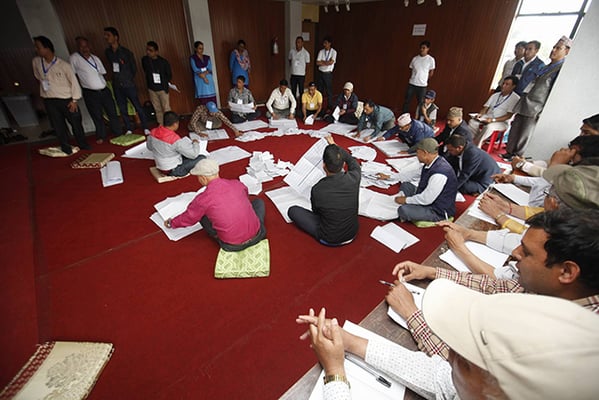 Officials start counting the votes of Kathmandu Metropolis at Rastriya Sabha Griha on Monday.