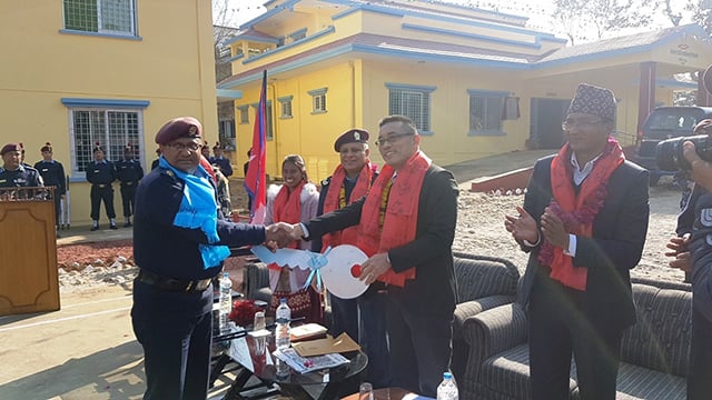 Kozo Nagami, senior representative of JICA Nepal hands over the key of the newly constructed buildings of the Palungtar Area Police Office in Gorkha to Chief of State-4, Police Assistant Inspector General Kamal Singh Bam on Tuesday.
