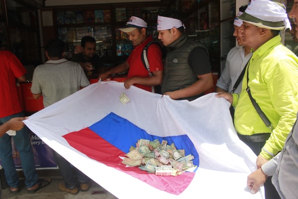 Members of Yuva Sangh Nepal collecting donations to aid victims of the Sindhupalchok flood on Tuesday.