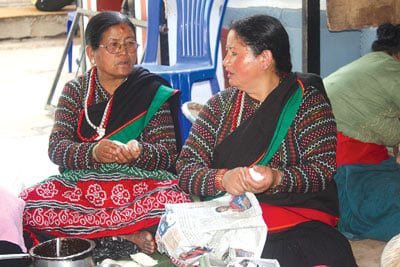 READY TO SELL: Newari women prepare Yomari at Patan Dhoka on Sunday during the week long Lalitpur Festival.