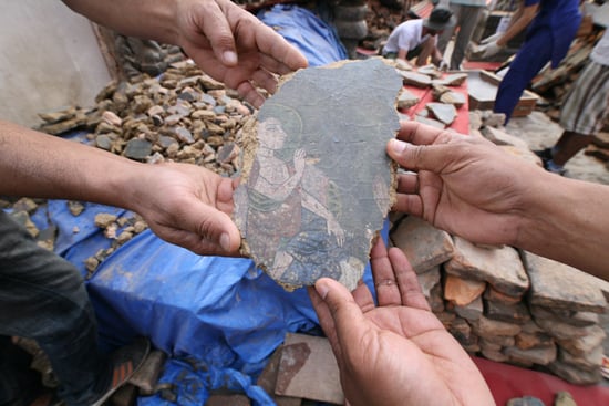 Pieces of ancient murals are recovered from the rubble at Swayambhu by UNESCO workers on Thursday.