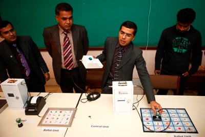 RIGHT TO VOTE: Ram Prasad Rimal, director of Technology Sales Pvt. Ltd, explains how to use an electronic voting machine at Nepal Tourism Board on Wednesday.