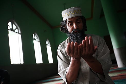 PRAYER TIME: A Muslim man offers prayers during the holy month of Ramadan at Jame Masjid near Ghanta Ghar.