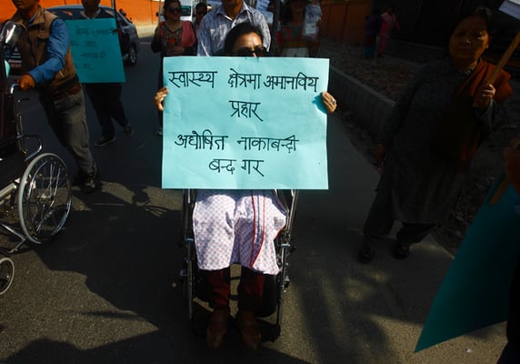 A differently abled person participates in a protest rally organised by a civil society group against the Indian blockade at Nagpokhari in Kathmandu on Monday.