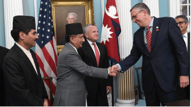 Nepali Minister of Finance Gyanendra Bahadur Karki, U.S. Deputy Secretary of State John J. Sullivan, and acting CEO of Millennium Challenge Corporation Jonathan Nash shake hands after the signing of the Millennium Challenge Corporation’s $500 million grant to upgrade connectivity and power transmission in Nepal in Washington DC on Friday.