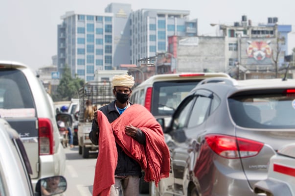 A man sells cloth for cleaning cars in Kupondole on Thursday.