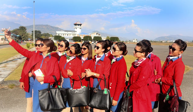 Flight attendants take a selfie at Pokhara Airport on Tuesday.