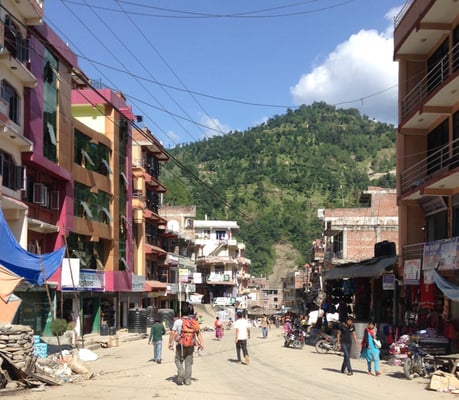 The main street of Melamchi town on Sunday where many have rebuilt their houses themselves, not waiting for government help.