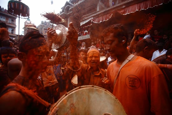 Devotees play with vermilion powder to celebrate Sindoor Jatra at Thimi on Wednesday. The festival marks the Nepali New Year and the beginning of the spring season in the country.